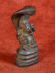 Bronzen Ganesha beschermd door mythische Naga