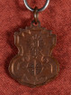 Rian Phra Ophasi brons amulet met yantra symbool