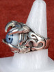 Zilveren draakklauw ring met licht blauw oog