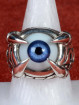 Zilveren draakklauw ring met donker blauw oog
