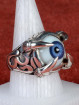 Zilveren draakklauw ring met donker blauw oog